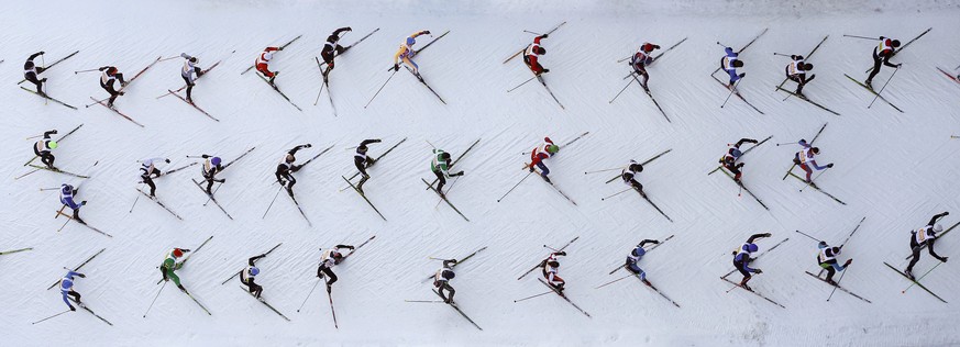 An aerial view shows cross-country skiers climbing a hill during the Engadin Ski Marathon near the Swiss mountain resort of St. Moritz March 8, 2015. According to the organizers, more than 13,000 skie ...