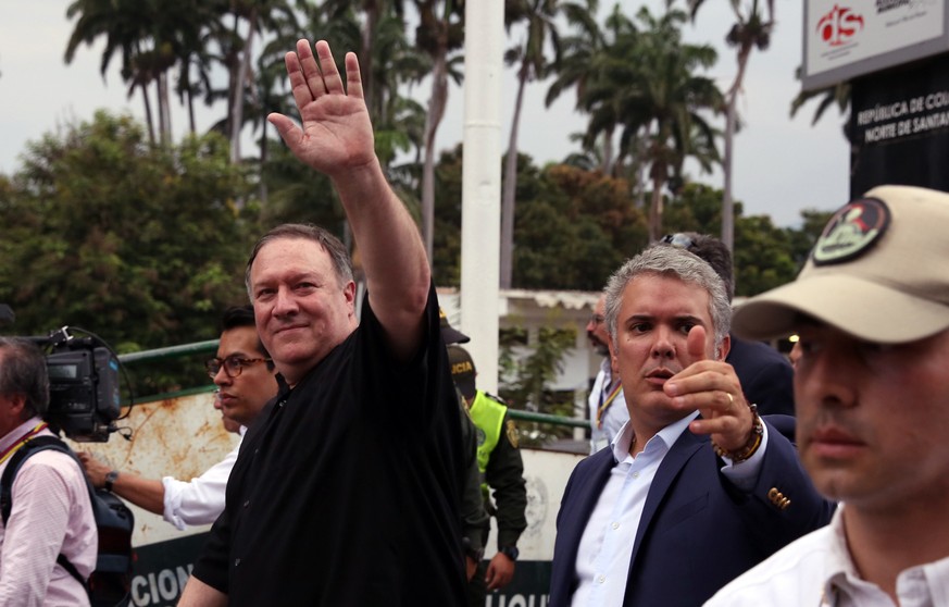 epa07507410 US Secretary of State Mike Pompeo (L) and Colombian President Ivan Duque (R) visit the Simon Bolivar bridge in the Colombian city of Cucuta, near the border with Venezuela, Colombia, 14 Ap ...