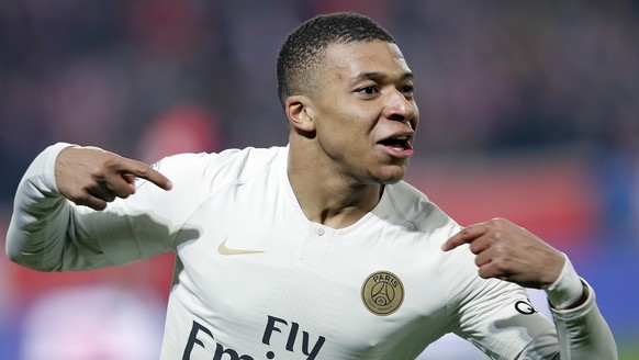 FILE - In this April 14, 2019 file photo, PSG&#039;s Kylian Mbappe celebrates after his team scored during the French League One soccer match between OSC Lille and Paris Saint-Germain at Stade Pierre  ...
