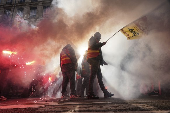 Protesters march during a demonstration in Lyon, central France, Thursday, Jan. 16, 2020. Protesters are denouncing French President Emmanuel Macron&#039;s plans to overhaul the national pension syste ...