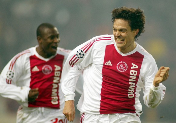 Jari Litmanen, right, and Abubakari Yakubu of Ajax celebrate the second goal of Ajax against AS Roma during their Champions League soccer match in Amsterdam, Tuesday, Dec 10, 2002. (AP Photo/Fred Erns ...