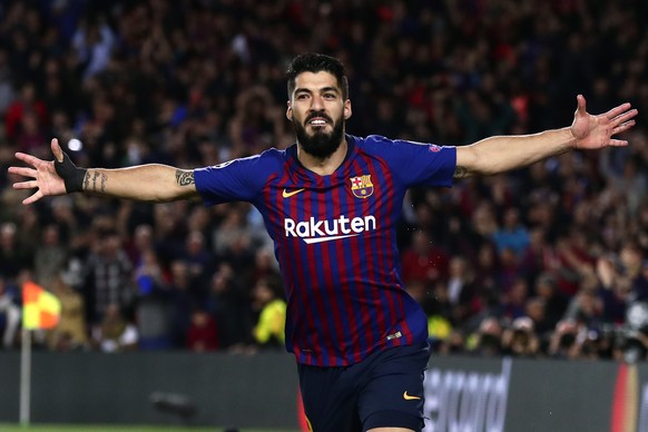 Barcelona&#039;s Luis Suarez celebrates scoring his side&#039;s first goal during the Champions League semifinal first leg soccer match between FC Barcelona and Liverpool at the Camp Nou stadium in Ba ...