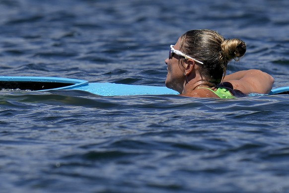 Spela Ponomarenko Janic Slovenia waits to be pulled out of the water after flipping her boat with Anja Osterman while competing in the women&#039;s kayak double 500m semifinalat the 2020 Summer Olympi ...
