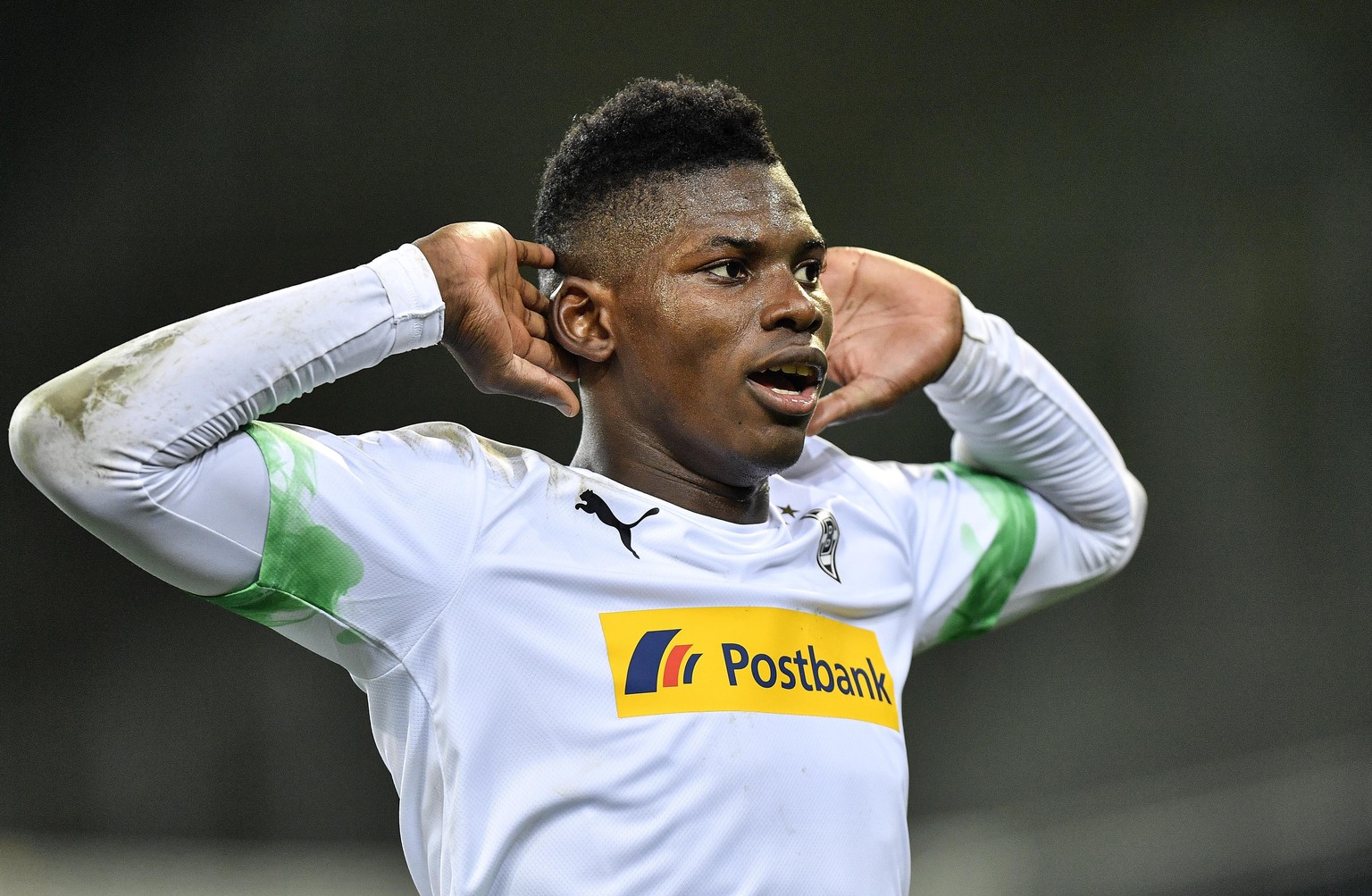 Moenchengladbach&#039;s Breel Embolo celebrates after he scored the opening goal during the German Bundesliga soccer match between Borussia Moenchengladbach and 1.FC Cologne in Moenchengladbach, Germa ...