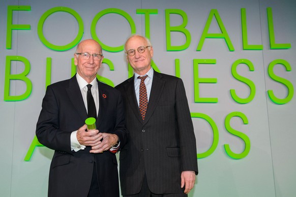 IMAGE DISTRIBUTED FOR THE FOOTBALL BUSINESS AWARDS - Sir Bobby Charlton is presented with the Global Ambassador Award by Bruce Buck, Chairman of Chelsea FC at the 2014 Football Business Awards on Thur ...