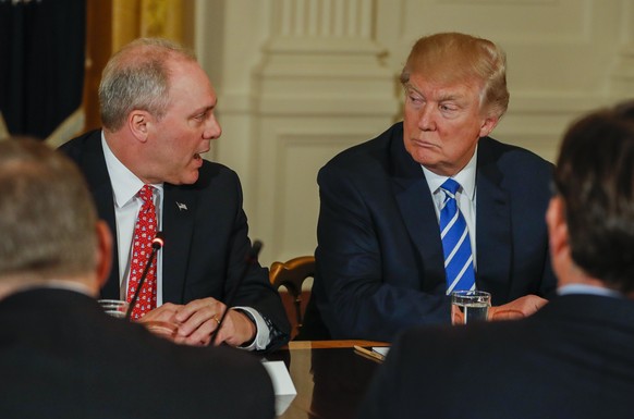 epa05835318 US President Donald J. Trump (R) listens to Representative Steve Scalise (L) of Louisiana of the US House of Representatives deputy Republican whip team, in the East Room of the White Hous ...