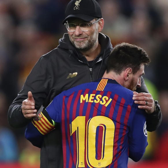 Barcelona&#039;s Lionel Messi, who scored two of the team&#039;s three goals, hugs Liverpool coach Juergen Klopp after the Champions League semifinal first leg soccer match between FC Barcelona and Li ...