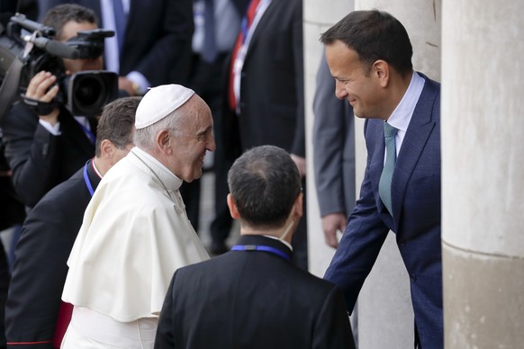 Pope Francis meets with Irish Prime Minister Leo Varadkar, right, as he arrives at Dublin Castle, Ireland, Saturday, Aug. 25, 2018. Pope Francis is on a two-day visit to Ireland. (AP Photo/Matt Dunham ...