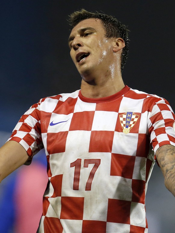 FILE - In this Nov. 19, 2013, file photo, Croatia&#039;s Mario Mandzukic reacts after receiving a red card after a foul against Iceland&#039;s Johann Gudmundsson during their World Cup qualifying play ...