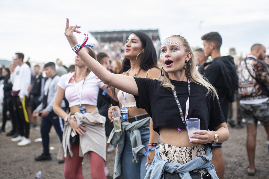 Festival visitors enjoy the show of American rapper Lil Baby during the Openair Frauenfeld music festival on Thursday, July 11, 2019, in Frauenfeld, Switzerland. The Openair Frauenfeld takes place fro ...