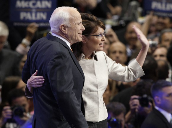 FILE - In this Sept. 3, 2008 file photo, then-Republican Presidential candidate, Sen. John McCain, R-Ariz., and his running mate Sarah Palin waves to the crowed as she is joined by McCain at the end o ...