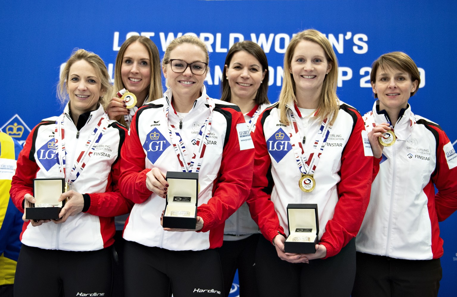 epa07460960 Switzerland&#039;s team pose whit medals after winning the gold match between Switzerland and Sweden during the Women&#039;s Curling World Championship in Silkeborg, Denmark, 24 March 2019 ...
