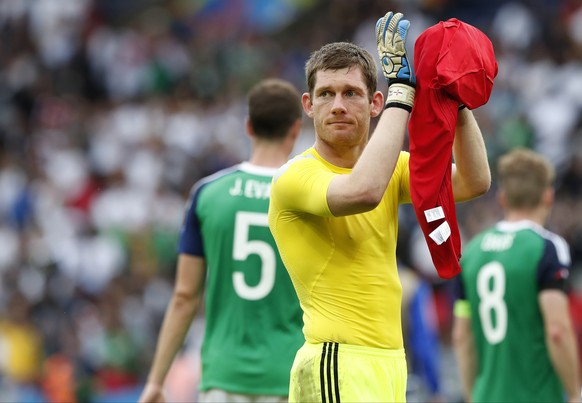 Northern Ireland goalkeeper Michael Mcgovern applauds at the end of the Euro 2016 Group C soccer match between Northern Ireland and Germany at the Parc des Princes stadium in Paris, France, Tuesday, J ...