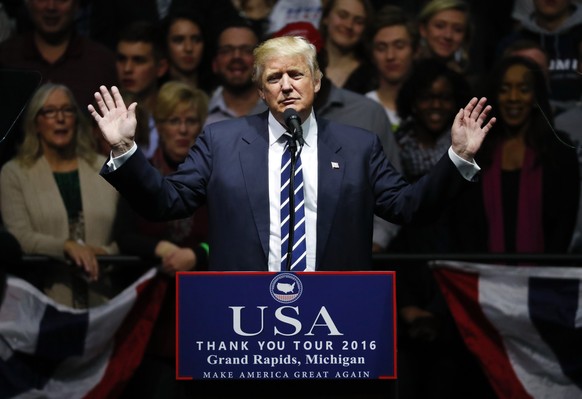 FILE - In this Dec. 9, 2016, file photo, President-elect Donald Trump speaks to supporters during a rally, in Grand Rapids, Mich. The area around Grand Rapids has been very good to President Donald Tr ...