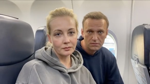 epa08959647 A frame grab of Alexei Navalny and Yulia Navalnaya taken from a video posted on the Instagram account @navalny shows Russian opposition Leader Alexei Navalny before his flight at the Berli ...