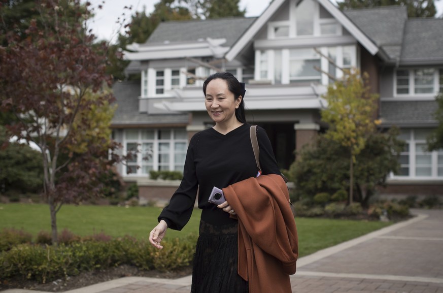 Huawei chief financial officer Meng Wanzhou, who is out on bail and remains under partial house arrest after she was detained last year at the behest of American authorities, leaves her home to attend ...