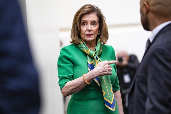 epa08127706 US Speaker of the House Nancy Pelosi (C) departs a Democratic caucus meeting after announcing the House will vote on 15 January to send the articles of impeachment to the Senate in the US  ...