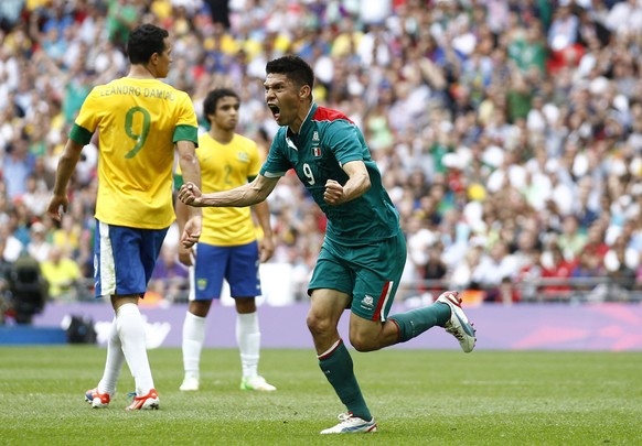 Mexico&#039;s Oribe Peralta, right, celebrates in front of Brazil&#039;s Leandro Damiao, left, during the men&#039;s soccer final at the 2012 Summer Olympics, Saturday, Aug. 11, 2012, in London. (AP P ...