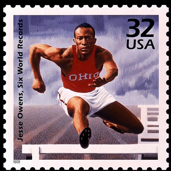 The U.S. Postal Service honors Jesse Owens, shown on a new stamp running the hurdles in his Ohio University uniform. Winner of four track events in the 1936 Berlin Olympics, Owens&#039; performance sh ...