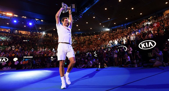 epa06480967 Winner Roger Federer of Switzerland holds his trophy after the awarding ceremony of the men&#039;s final match at the Australian Open Grand Slam tennis tournament in Melbourne, Australia,  ...