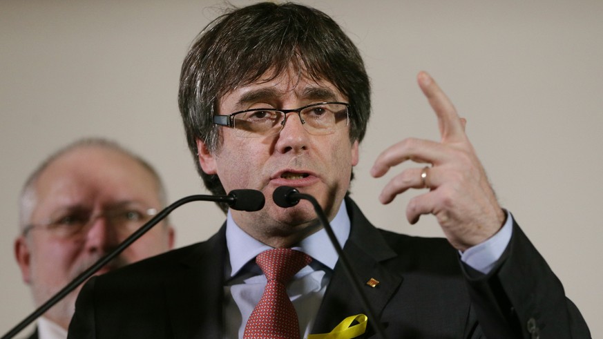 Ousted Catalan leader Carles Puigdemont, center, speaks during a during a press conference at the Square Meeting Center in Brussels on Thursday, Dec. 21, 2017. The pro-secession bloc won a majority in ...