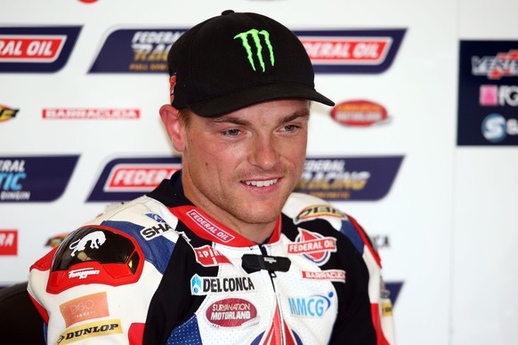 epa05522320 British rider Sam Lowes of Federal Oil Gresini Moto2 Team reacts during the Moto2 practice session of the 2016 British Motorcycling Grand Prix at the Silverstone race track, Northampton, B ...