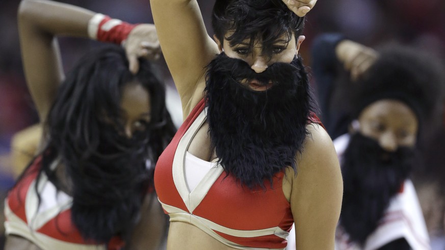 Houston Rockets Power Dancers and staff dance wearing beards mimicking Rockets&#039; James Harden during a timeout in the first half of an NBA basketball game against the Cleveland Cavaliers, Sunday,  ...