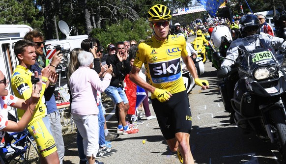 epa05424704 British rider Christopher Froome (C) of Team Sky runs without his bicycle after crashing during the 12th stage of the 103rd edition of the Tour de France cycling race over 178km between Mo ...