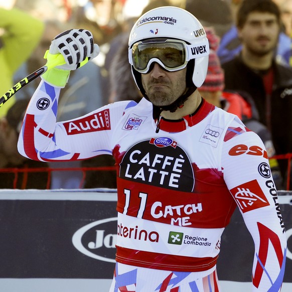 France&#039;s Adrien Theaux celebrates in the finish area after completing a men&#039;s World Cup downhill in Santa Caterina Valfurva, Italy, Tuesday, Dec. 29, 2015. (AP Photo/Alessandro Trovati)