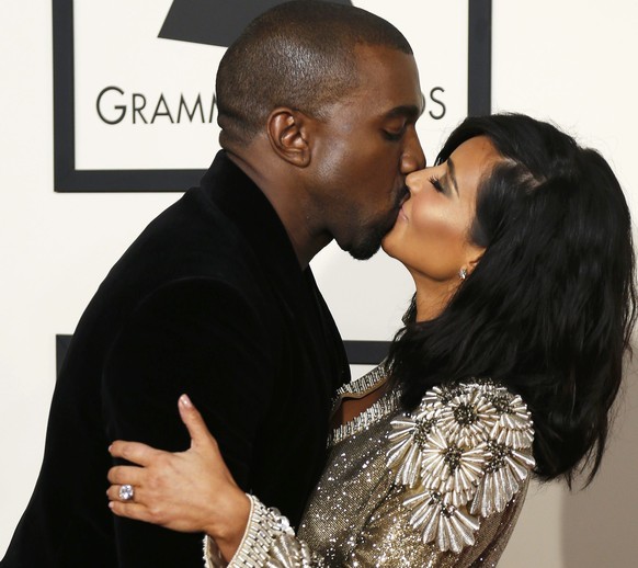 Rapper Kanye West and Kim Kardashian arrive at the 57th annual Grammy Awards in Los Angeles, California February 8, 2015. REUTERS/Mario Anzuoni (UNITED STATES - TAGS: ENTERTAINMENT) (GRAMMYS-ARRIVALS)