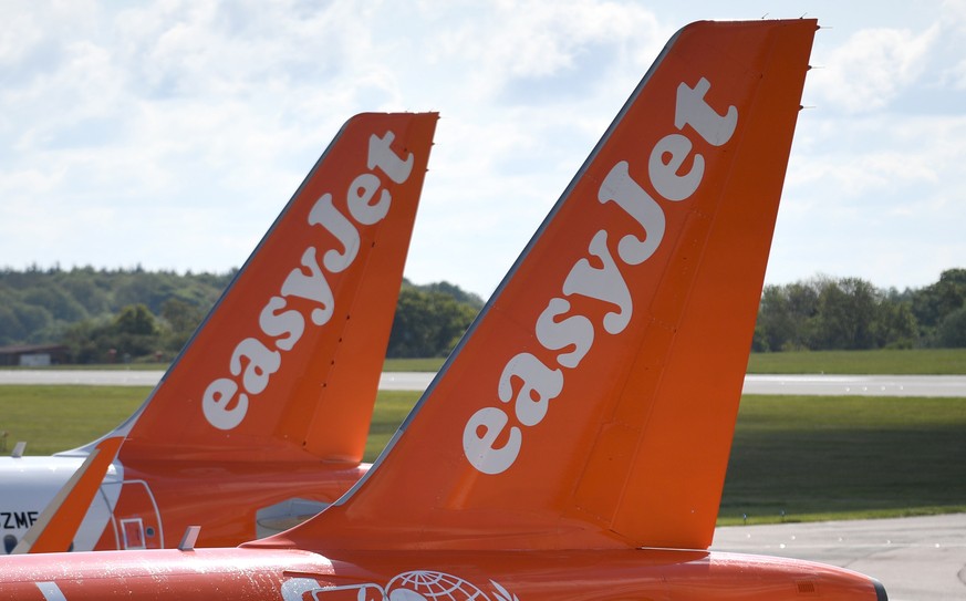 epa08397428 EasyJet aircraft are parked at Luton Airport, in Britain, 02 May 2020. Due to the coronavirus number UK daily flights has fallen and in some routes have been suspended. British Airways&#03 ...