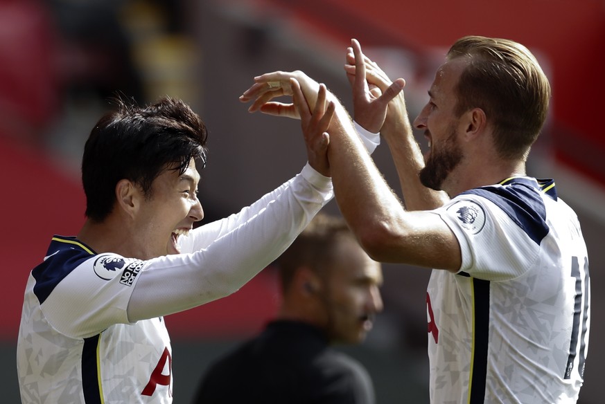 epa08683576 Son Heung-min (L) of Tottenham celebrates with teammate Harry Kane (R) after scoring his third goal during the English Premier League match between Southampton and Tottenham Hotspur in Sou ...