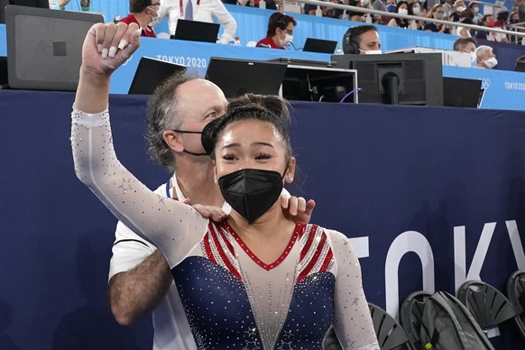 Sunisa Lee, of the United States, celebrates with her coach Jeff Graba after she won the gold medal in the artistic gymnastics women&#039;s all-around at the 2020 Summer Olympics, Thursday, July 29, 2 ...