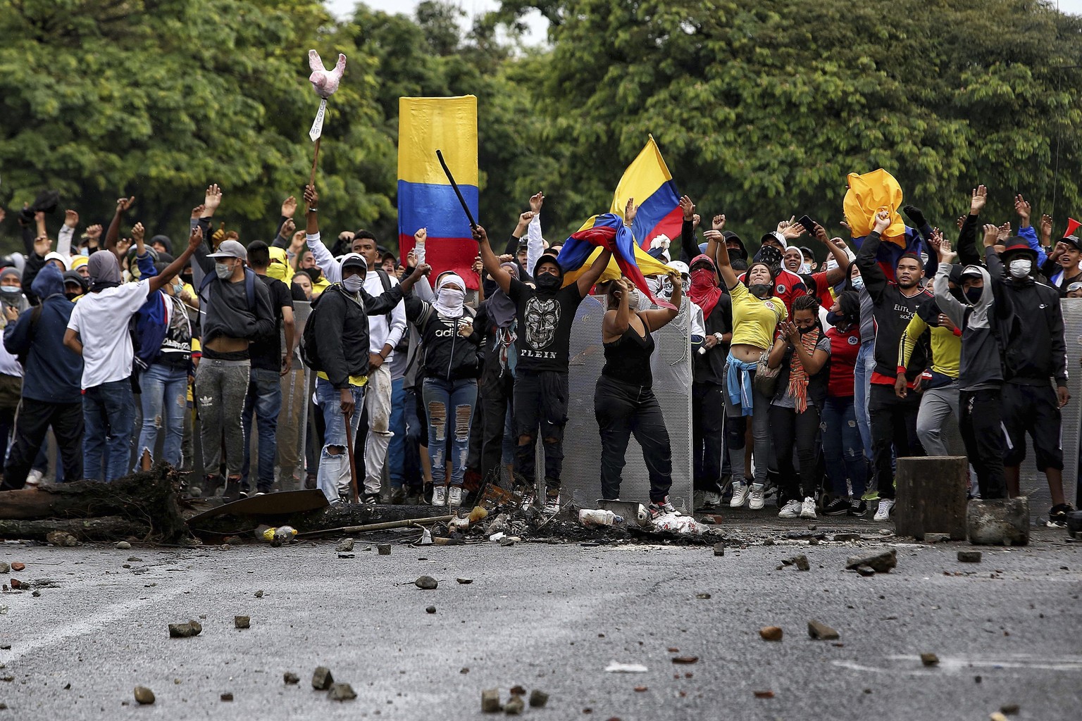 Protesters chant anti-government slogans during a national strike to protest government-proposed tax reform, in Cali, Colombia, Friday, April 30, 2021. (AP Photo/Andres Gonzalez)
