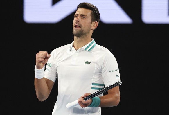 Serbia&#039;s Novak Djokovic celebrates after defeating Canada&#039;s Milos Raonic during their fourth round match at the Australian Open tennis championship in Melbourne, Australia, Sunday, Feb. 14,  ...