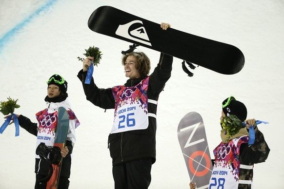 Switzerland&#039;s Iouri Podladtchikov, center, celebrates his gold medal in the men&#039;s snowboard halfpipe final as he is flanked by silver medalist Ayumu Hirano, left, of Japan, and bronze medali ...