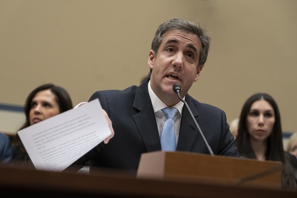 FILE - In this Wednesday, Feb. 27, 2019 file photo, Michael Cohen, President Donald Trump&#039;s former personal lawyer, reads an opening statement as he testifies before the House Oversight and Refor ...