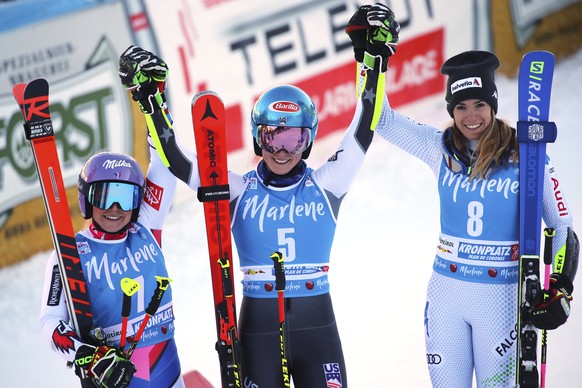 From left, second placed France&#039;s Tessa Worley, first placed United States&#039; Mikaela Shiffrin and third placed Italy&#039;s Marta Bassino celebrate at the end of an alpine ski, women&#039;s W ...