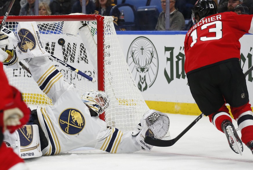 Buffalo Sabres goalie Linus Ullmark (35) is scored on by New Jersey Devils forward Nico Hischier (13) during the second period of an NHL hockey game Monday, Dec. 2, 2019, in Buffalo, N.Y. (AP Photo/Je ...