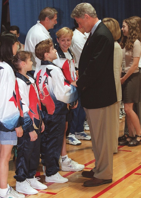 President Clinton and daughter Chelsea, far right, greets members of the U.S. gymnastics team during a visit to the Summer Olympics in Atlanta, on Thursday, July 25, 1996. From left: Amy Chow, Dominiq ...