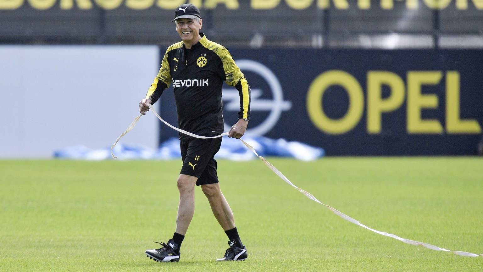 Head coach Lucien Favre prepares the first training session of Bundesliga soccer club Borussia Dortmund for the new season in Dortmund, Germany, Friday, July 5, 2019. (AP Photo/Martin Meissner)
