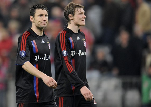 Munich&#039;s Mark van Bommel, left, and Marcell Jansen leave the pitch after their UEFA Cup semi-final first leg soccer match between FC Bayern Munich and Zenit St. Petersburg in Munich, southern Ger ...