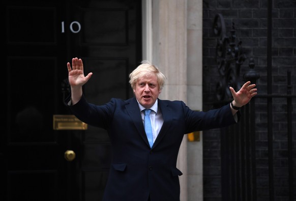 epa08436397 Britain&#039;s Prime Minister Boris Johnson takes part in the &#039;Clap For Our Carers&#039; initiative in support of the National Health Service (NHS) in Downing Street in London, Britai ...