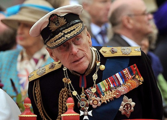 FILE - A Sunday June 3, 2012 photo from files showing Prince Philip watching the proceedings from the royal barge during the Diamond Jubilee Pageant on the River Thames in London. Buckingham Palace sa ...