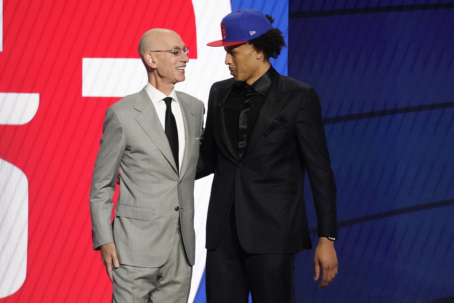 NBA Commissioner Adam Silver greets Cade Cunningham who was picked as the number one overall pick by the Detroit Pistons during the NBA basketball draft, Thursday, July 29, 2021, in New York. (AP Phot ...