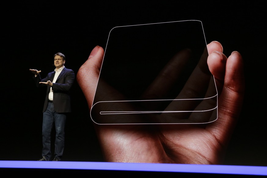 Justin Denison, SVP of Mobile Product Development, talks about the Infinity Flex Display of a folding smartphone during the keynote address of the Samsung Developer Conference, Wednesday, Nov. 7, 2018 ...