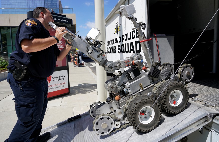 A Cleveland police bomb squad technician loads a Remotec F5A explosive ordnance device robot during a demonstration of police capabilities near the site of the Republican National Convention in Clevel ...