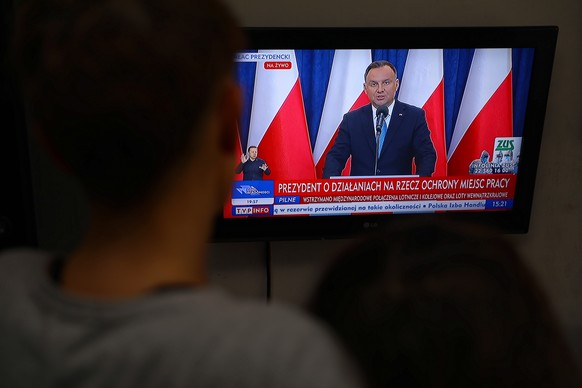 epa08311823 A television screen shows Polish President Andrzej Duda during a press conference in Warsaw, Poland, 21 March 2020. Duda announced that self-employed people and small businesses will be ex ...