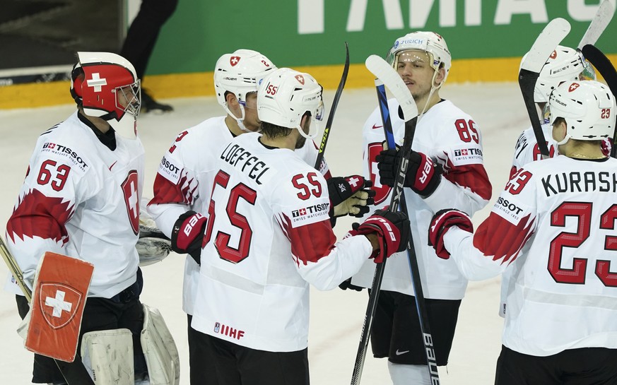 Switzerlan&#039;s team players celebrate victory after the Ice Hockey World Championship group A match between the Belarus and Switzerland at the Olympic Sports Center in Riga, Latvia, Sunday May 30,  ...