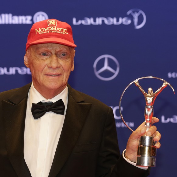 Former Formula One driver Niki Lauda shows off a Laureus Lifetime Achievement Award at the Laureus World Sports Awards in Berlin, Germany, Monday, April 18, 2016. (AP Photo/Markus Schreiber)